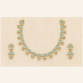 Alai gold-tone aqua blue stone necklace set with crystal accents and matching statement earrings